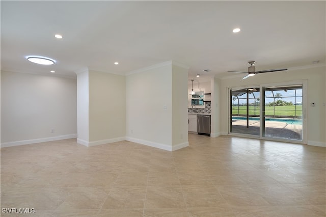 unfurnished living room featuring ceiling fan and ornamental molding