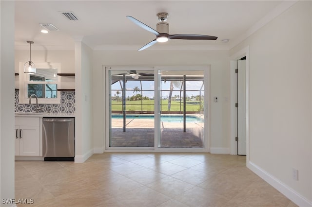 interior space featuring ceiling fan, sink, light tile patterned floors, and ornamental molding