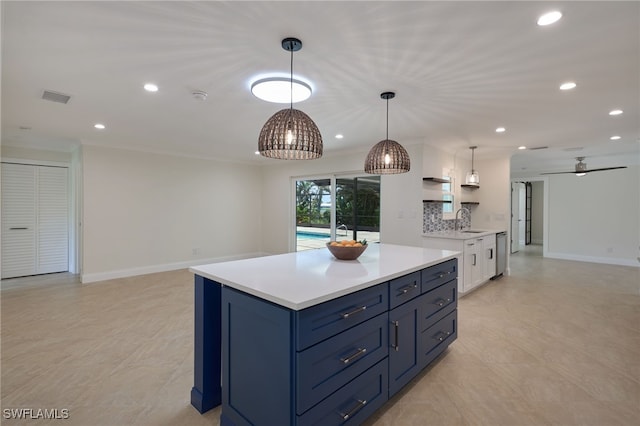 kitchen with white cabinets, sink, backsplash, hanging light fixtures, and ceiling fan