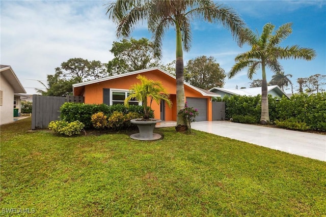 view of front facade featuring a garage and a front lawn