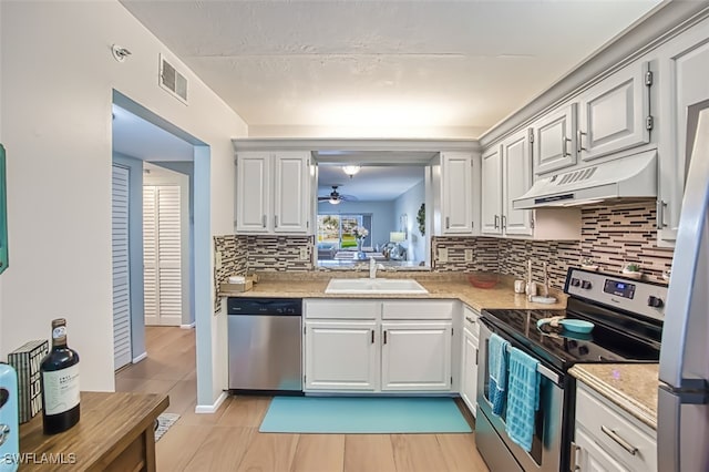 kitchen with white cabinets, sink, and stainless steel appliances