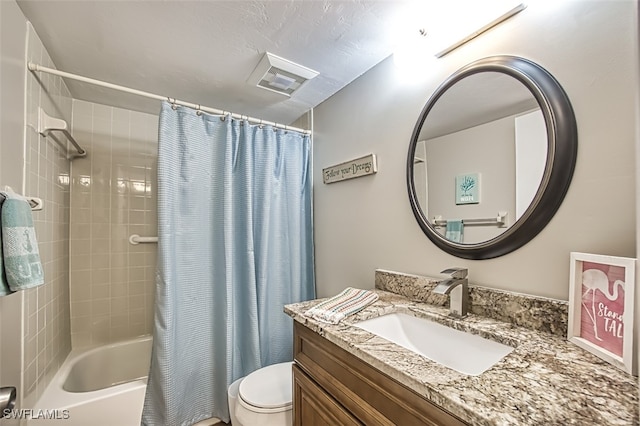 full bathroom featuring toilet, vanity, and shower / tub combo with curtain