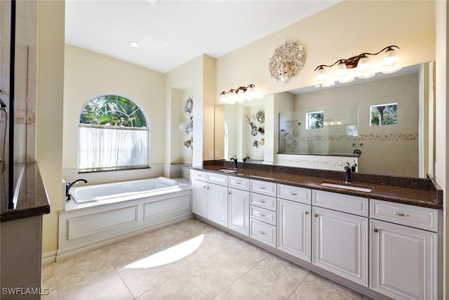 bathroom with vanity, plus walk in shower, and tile patterned flooring