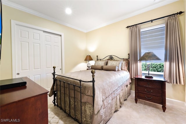 bedroom with ornamental molding and a closet