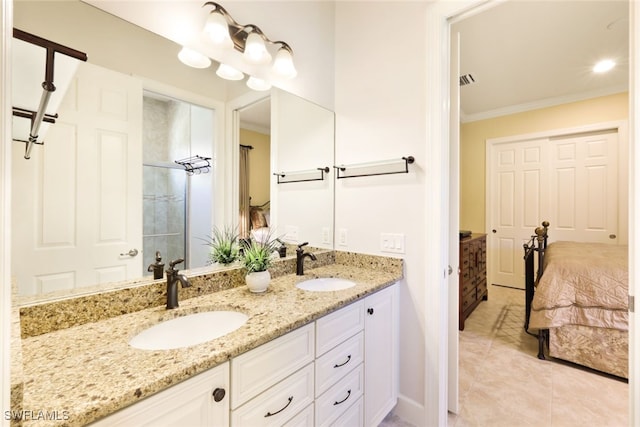 bathroom with vanity, crown molding, and tile patterned floors