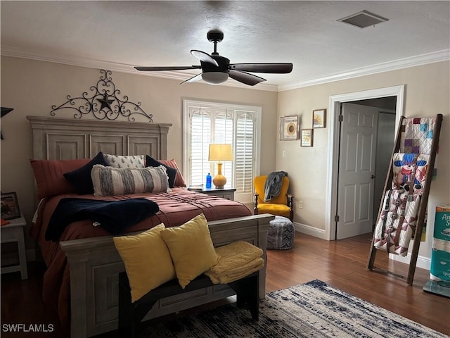 bedroom featuring ceiling fan, hardwood / wood-style floors, and ornamental molding