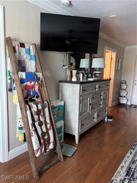 interior space with crown molding and wood-type flooring