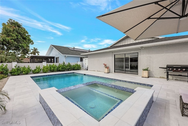 738 101st Ave N, Naples, FL 34108 - view of swimming pool with a fenced backyard, a pool with connected hot tub, a patio area, and grilling area