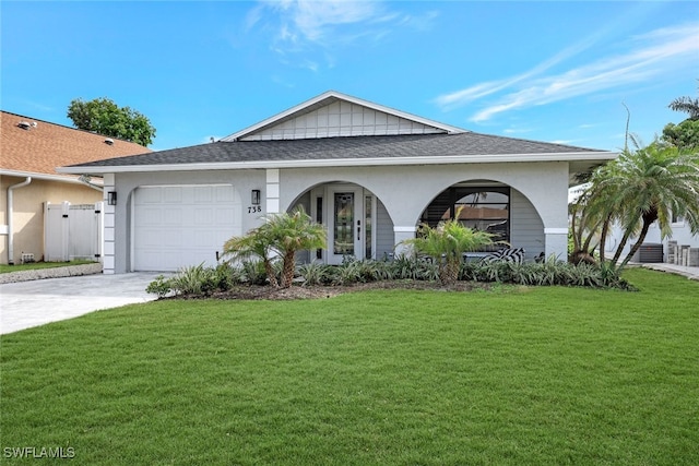 ranch-style house featuring a garage and a front lawn