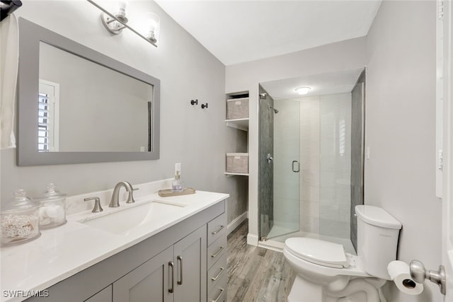 738 101st Ave N, Naples, FL 34108 - full bathroom with toilet, wood finished floors, vanity, and a stall shower
