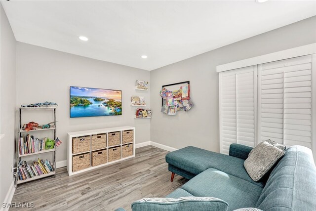 738 101st Ave N, Naples, FL 34108 - living room with baseboards, wood finished floors, and recessed lighting