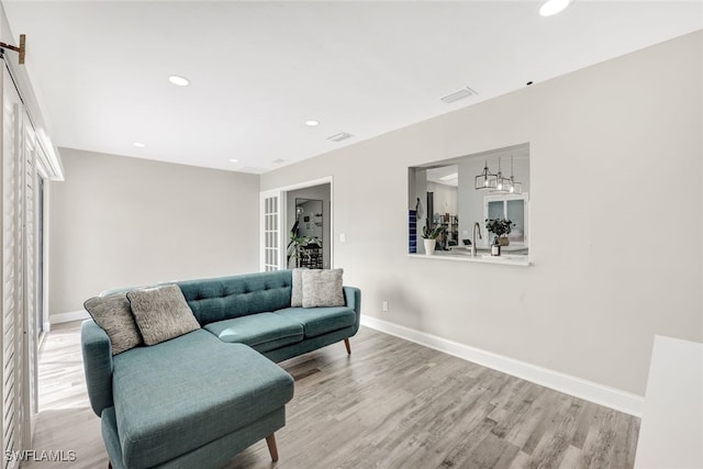 738 101st Ave N, Naples, FL 34108 - living area featuring baseboards, light wood-type flooring, and recessed lighting