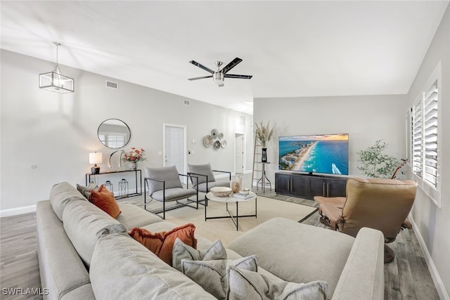 738 101st Ave N, Naples, FL 34108 - living area featuring wood finished floors, baseboards, and ceiling fan