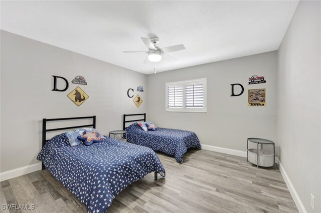 738 101st Ave N, Naples, FL 34108 - bedroom featuring wood finished floors, baseboards, and a ceiling fan