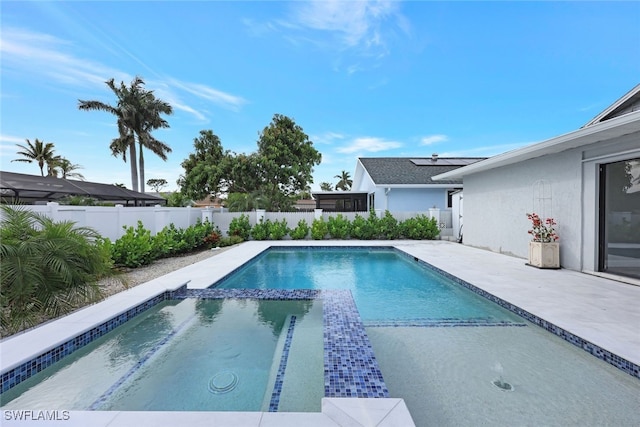 738 101st Ave N, Naples, FL 34108 - view of swimming pool with a fenced backyard, a pool with connected hot tub, and a patio area