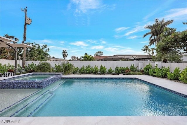 738 101st Ave N, Naples, FL 34108 - view of pool featuring a fenced backyard and a pool with connected hot tub