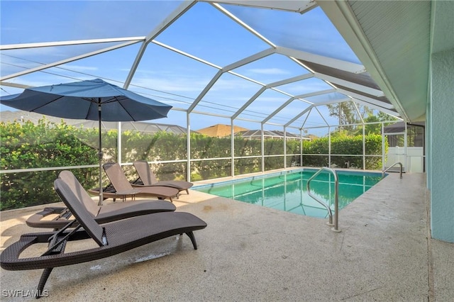 view of swimming pool featuring a patio area, a mountain view, and glass enclosure