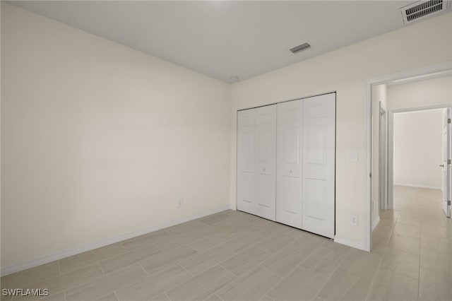 unfurnished bedroom with a closet