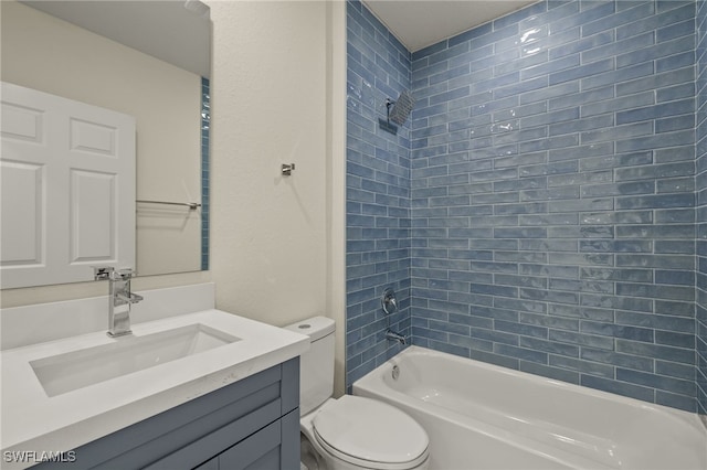 full bathroom with tiled shower / bath combo, vanity, and toilet