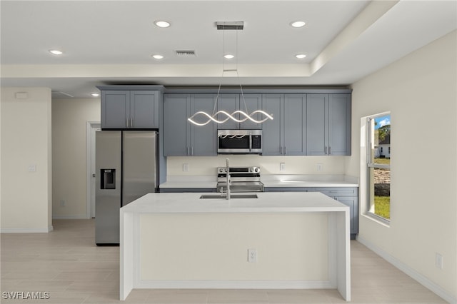 kitchen with recessed lighting, light countertops, visible vents, a sink, and appliances with stainless steel finishes