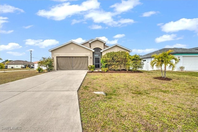 ranch-style home with a garage and a front lawn