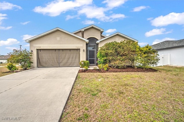 single story home featuring a garage and a front lawn