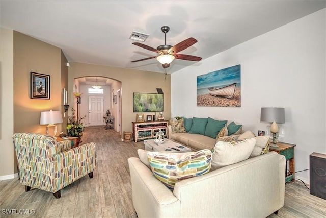 living room with ceiling fan and wood-type flooring