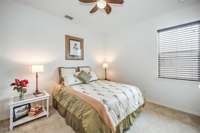 carpeted bedroom with ceiling fan