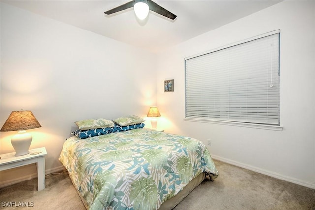 bedroom with ceiling fan and light colored carpet