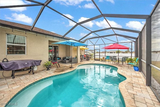 view of swimming pool featuring a lanai, an outdoor living space, a patio area, and grilling area