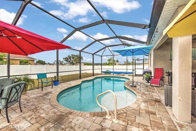 view of pool featuring a lanai and a patio area