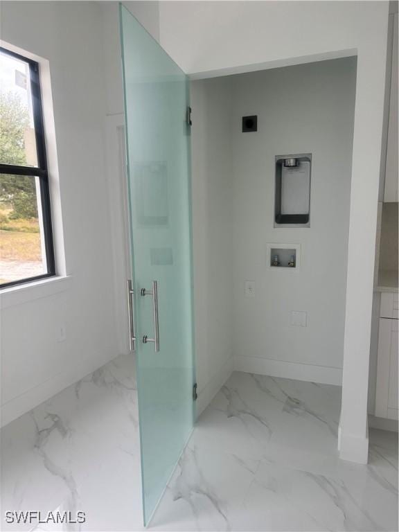 bathroom featuring a shower with shower door