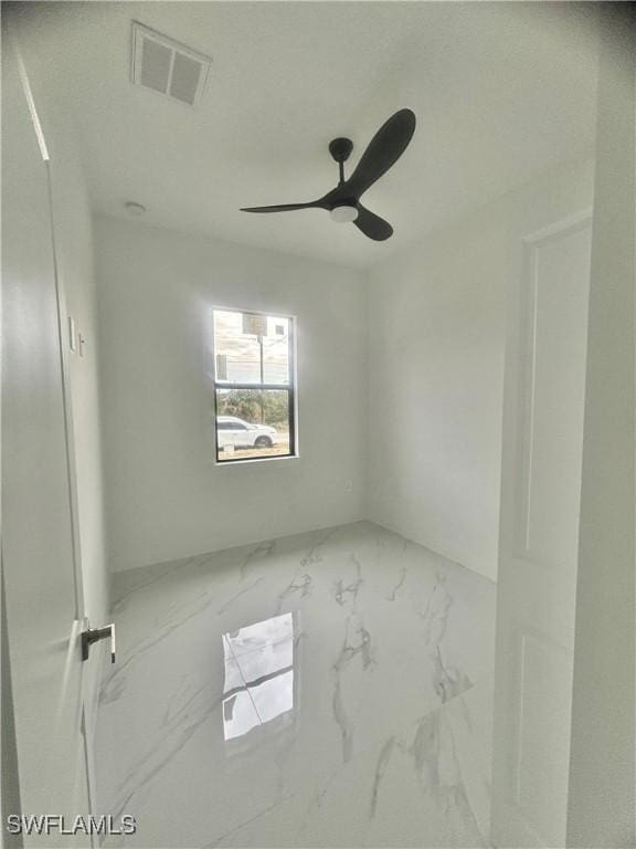 unfurnished room featuring ceiling fan