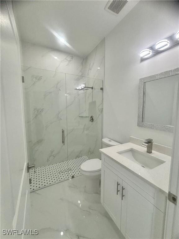 bathroom featuring toilet, vanity, and walk in shower