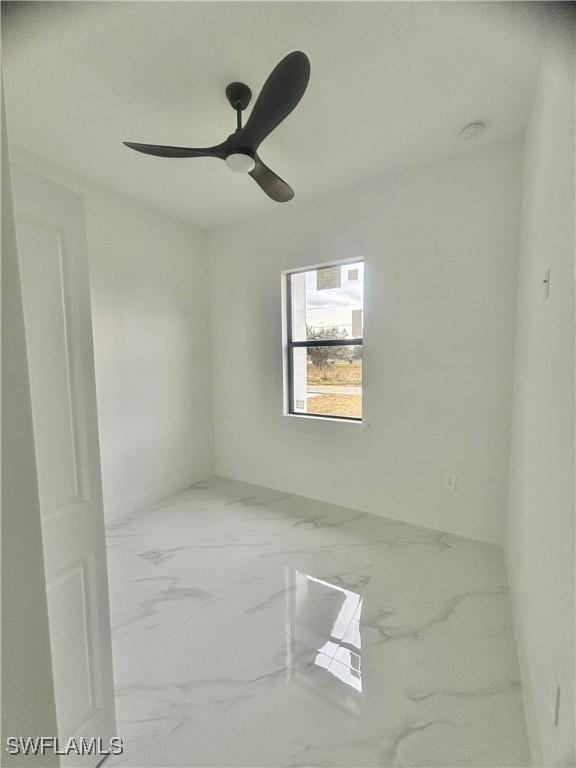 3204 20th St SW, Lehigh Acres, FL 33976 - unfurnished room featuring marble finish floors and ceiling fan
