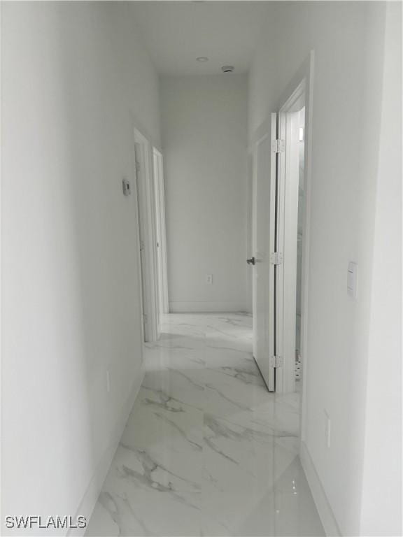 3204 20th St SW, Lehigh Acres, FL 33976 - corridor with light marble finish floors