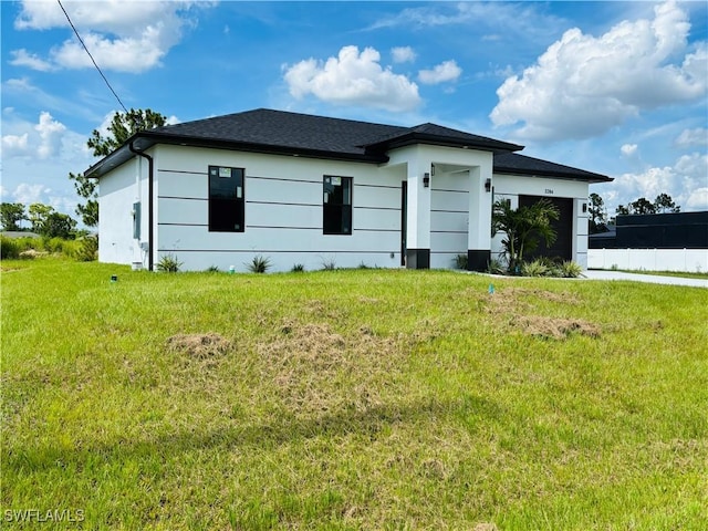 3204 20th St SW, Lehigh Acres, FL 33976 - view of side of property with a lawn