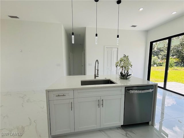 3204 20th St SW, Lehigh Acres, FL 33976 - kitchen featuring dishwasher, light marble finish flooring, hanging light fixtures, light stone countertops, and white cabinets