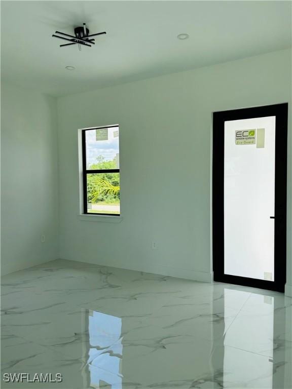 3204 20th St SW, Lehigh Acres, FL 33976 - empty room featuring light marble finish flooring and recessed lighting