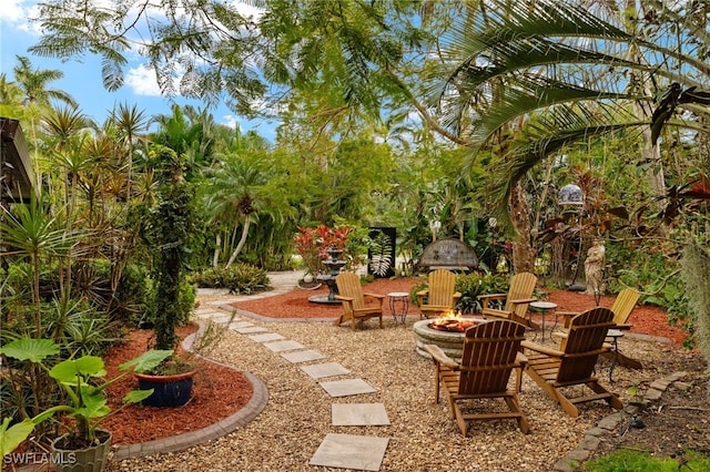 view of yard with a fire pit