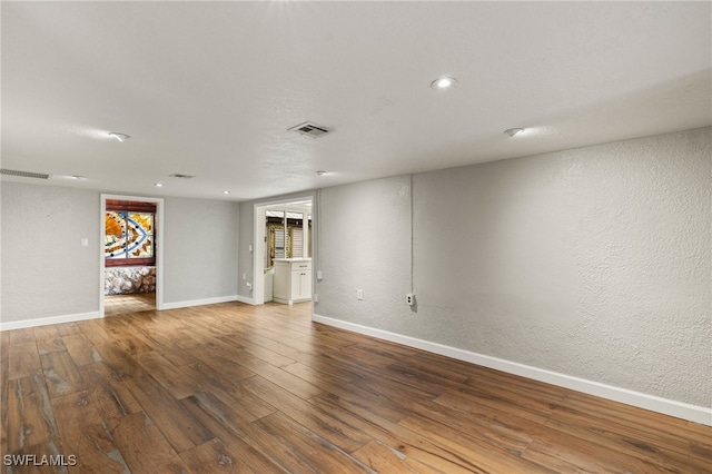 empty room featuring wood-type flooring