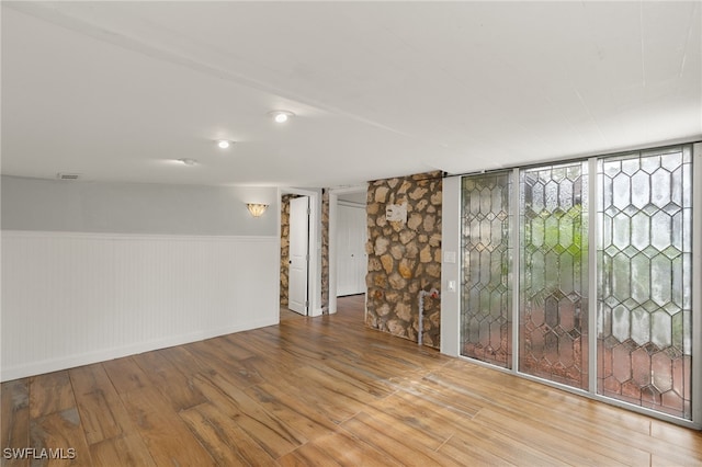 basement featuring hardwood / wood-style floors