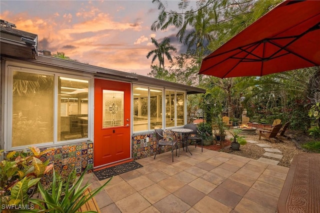 patio terrace at dusk with an outdoor fire pit