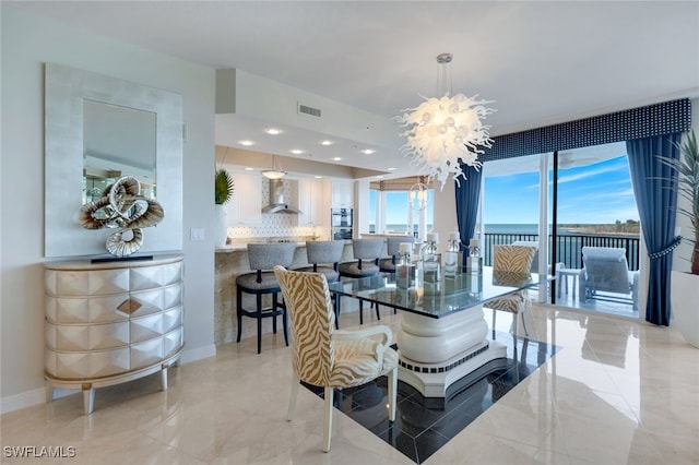 dining space with a notable chandelier