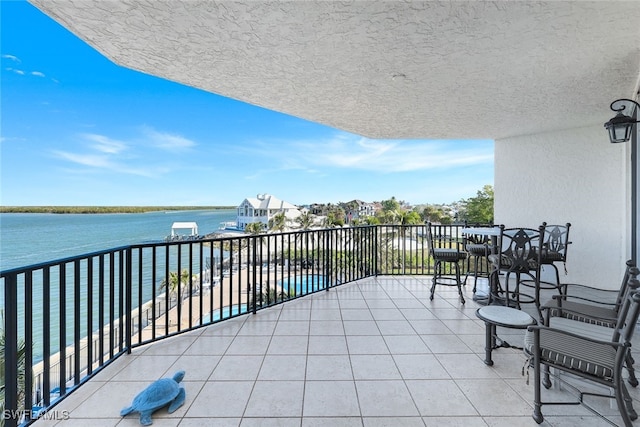 balcony featuring a water view