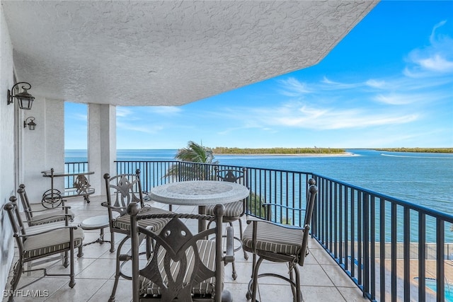 balcony featuring a water view