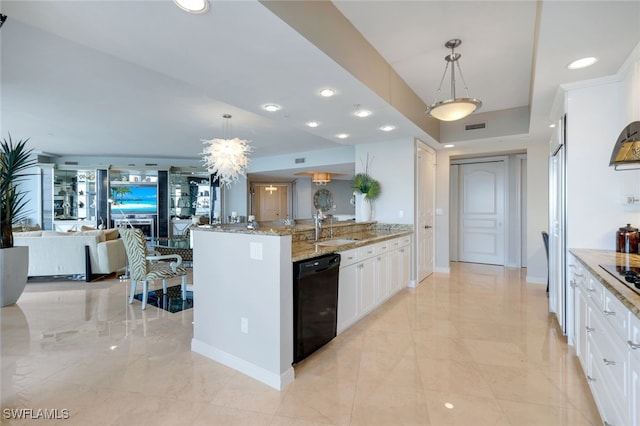 kitchen featuring decorative light fixtures, dishwasher, sink, white cabinets, and light stone counters