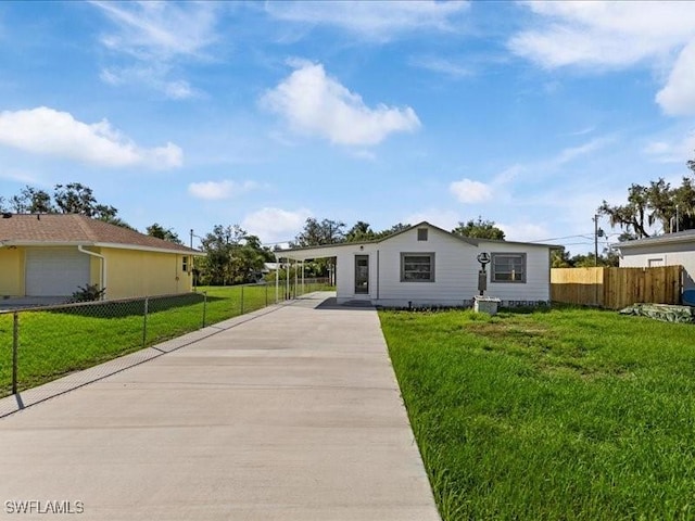 ranch-style house with a front lawn and a carport