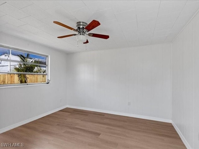 spare room with ceiling fan and hardwood / wood-style floors