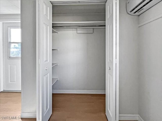 closet featuring a wall unit AC